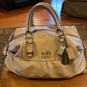 Coach cream satchel w/ gold hardware and lavender lining; zip closure